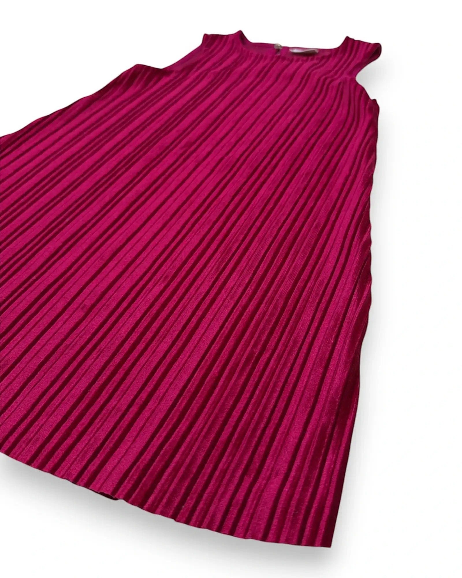 Petit Fox Portugal fuchsia pleated A-line dress with keyhole back detail. Shimmering fabric, sleeveless, perfect for special occasions.
