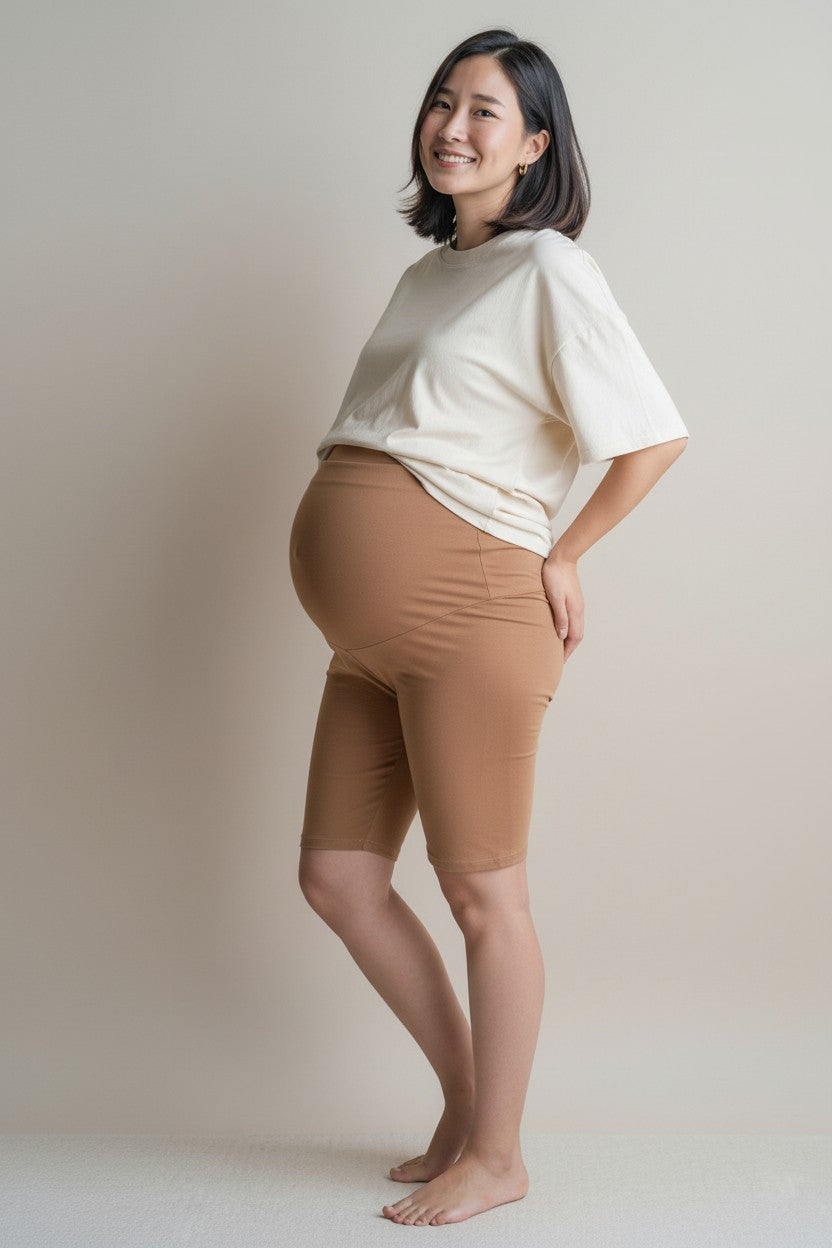 Petit Fox Portugal maternity biker shorts in camel, featuring a high-rise over-the-belly waistband and breathable, stretchy fabric.